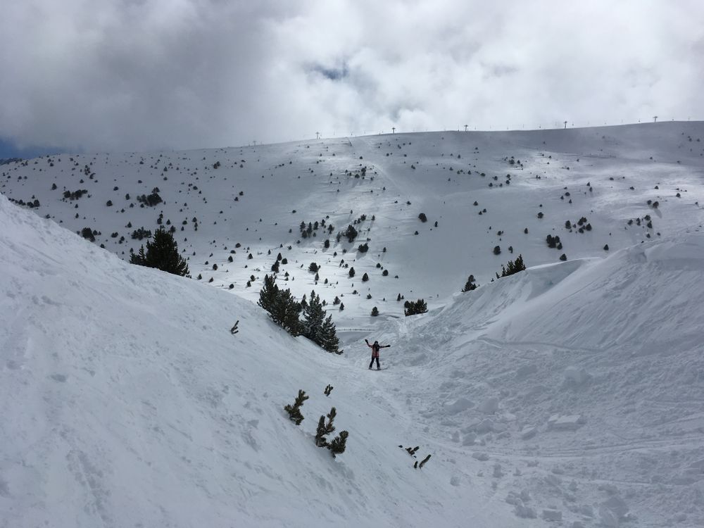 Riding off-piste through the gully under the Solana chairlift