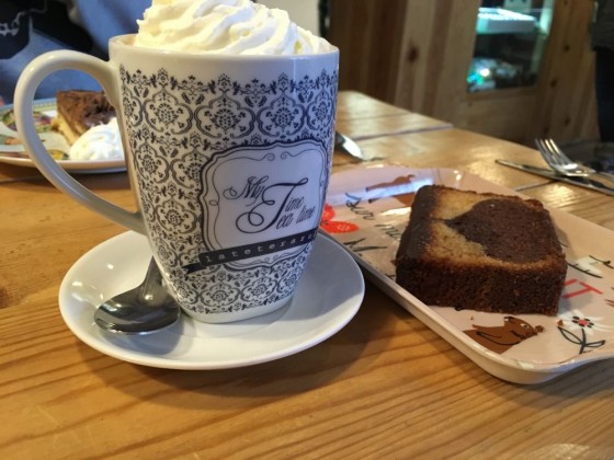 Treating a ourselves to a hot chocolate and home-made cake in Cafe del Bosc!