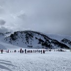 Skiers and snowboarders at the top of the Soldeu gondola