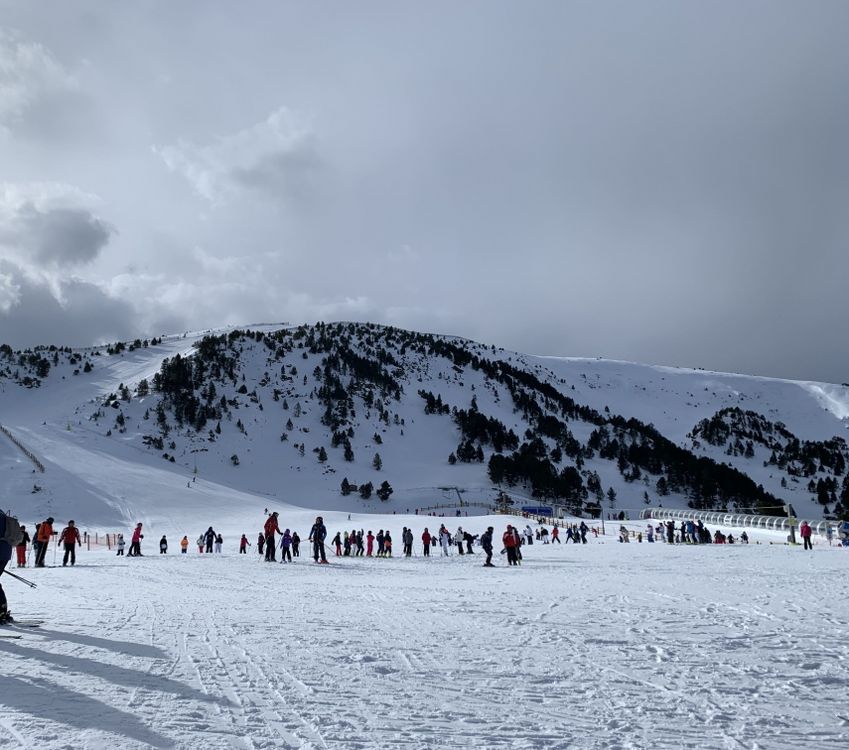 Skiers and snowboarders at the top of the Soldeu gondola