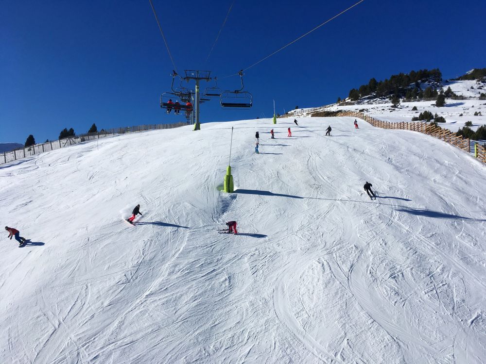 Skiers and boarders on the Duc slope